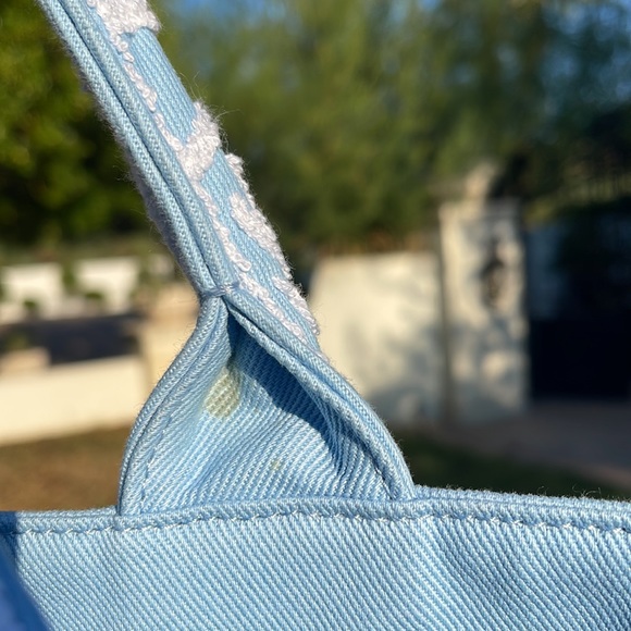 This Prada embroidered drill tote features an enlarged Prada logo on the front. - Picture 6 of 11